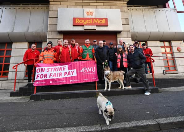 Royal Mail workers at Tomb Street in Belfast on strikes in a long-running dispute over pay and conditions.