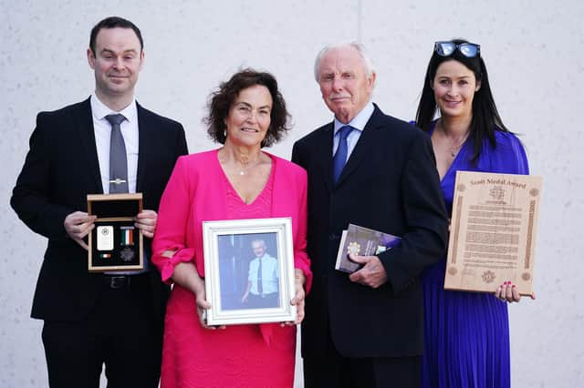 Don Tidey (second right) with Caroline Kelleher (second left) wife of the late Sergeant Daniel Kelleher, daughter Lesley Kelleher and son Daniel Kelleher. Sergeant Kelleher was posthumously awarded the Bronze Scott Medal during a ceremony to award deceased, retired and serving members of An Garda Siochana with bravery medals at Walter Scott House, Military Road, Dublin. Sergeant Kelleher was shot during Gardai’s response to the abduction of businessman Don Tidey in December 1983.