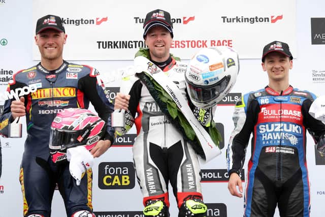 Richard Cooper (right) on the Superstock rostrum at last year's North West 200 with race winner Alastair Seeley and Davey Todd (left)