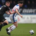 Barrow's Sam McClelland (left) battles with Hartlepool United's Connor Jennings during the Sky Bet League 2 match between Hartlepool United and Barrow at Victoria Park, Hartlepool in April