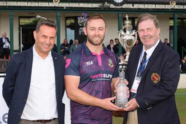 Ross Adair collects his Gallagher Challenge Cup final Man of the Match award from Shane Matthews (Gallagher, left) and Roger Bell (NCU, right)