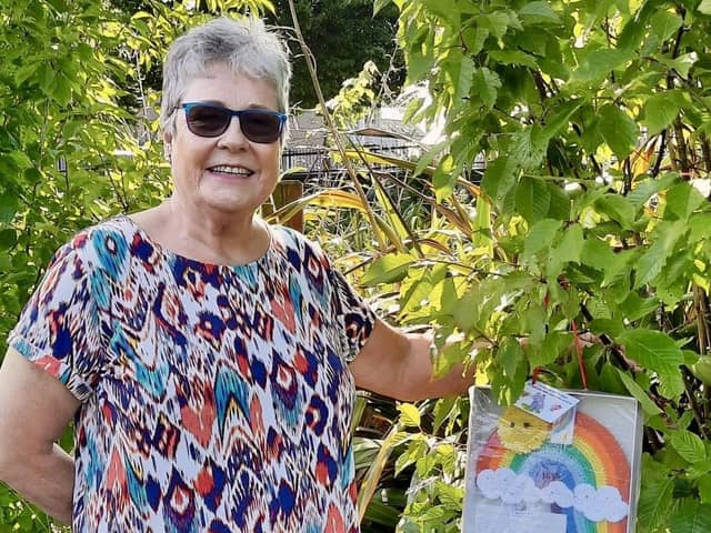 Banbridge grandma, Audrey Strong pictured hanging up a big rainbow which was one of her milestone creations (2,000th)