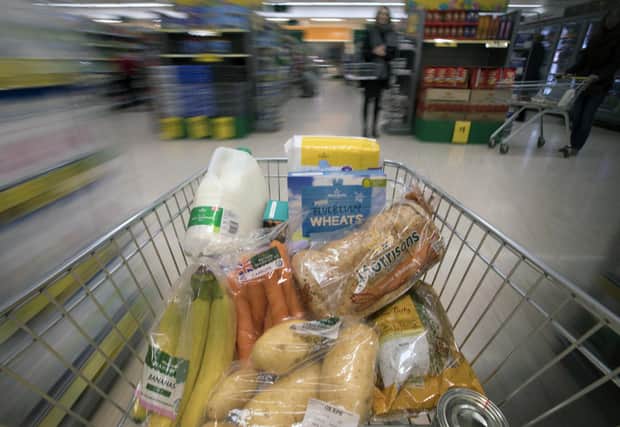 EMBARGOED TO 0001 WEDNESDAY NOVEMBER 30 File photo dated 04/04/17 of food in a shopping trolley. Food inflation has surged to 12.4% to hit a new record amid predictions of dampened Christmas cheer and an “increasingly bleak” winter. Issue date: Wednesday November 30, 2022.
