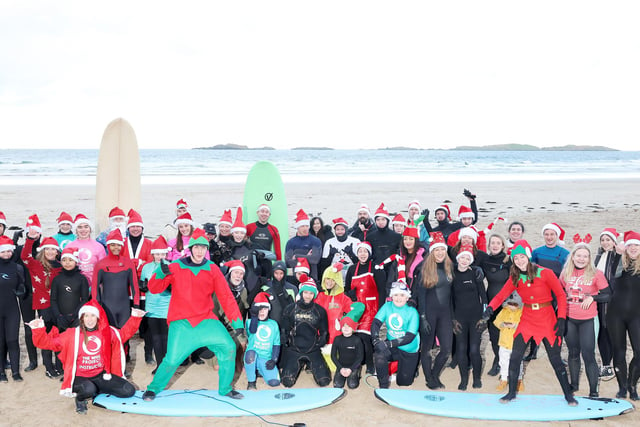 Wave Project Santa Surf 2022 takes place at the east strand in Portrush, Co. Antrim.  Surfers took to the waves for the 4th annual Santa surf followed by raffles, hot drinks, mince pies and live music

Picture by Jonathan Porter/PressEye:The Wave Project Santa Surf 2022 takes place at the east strand in Portrush, Co. Antrim:The Wave Project Santa Surf