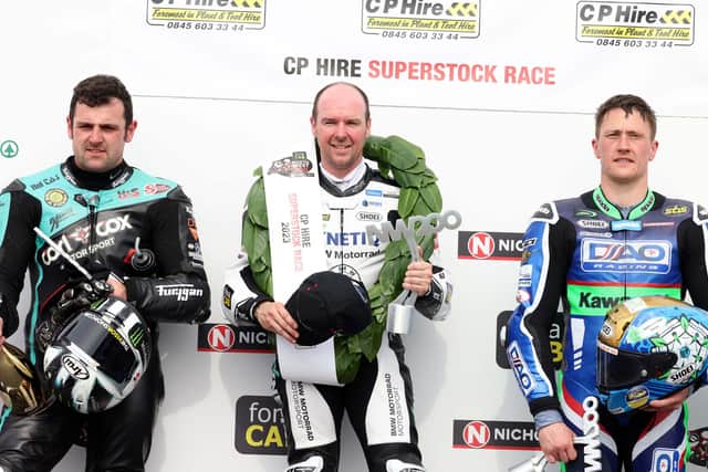 Superstock race winner Alastair Seeley with runner-up Michael Dunlop (left) and Dean Harrison