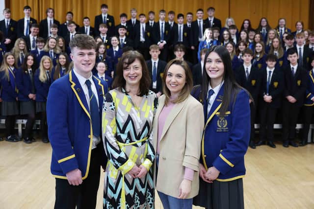 Amy Adair-McCourt (second left) and Charlotte Weir, Principal of Belfast High School, are pictured with head girl, Amy French and Head boy, Joel O'Rourke together with some of the other 100 Belfast High pupils set to get a potentially life-saving scan during Heart Month.