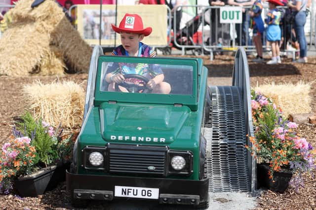 Eight-year-old Sonny Caffrey from Meath practices his driving skills in a mini Land Rover. (Photo: Jonathan Porter/Press Eye)