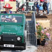 Eight-year-old Sonny Caffrey from Meath practices his driving skills in a mini Land Rover. (Photo: Jonathan Porter/Press Eye)