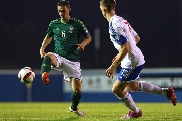 Northern Ireland's Chris Baird with Faroe Islands' Fródi Benjaminsen at Windsor Park. Baird played 79 times for his country and had a stellar career, playing in the Premier League for Southampton, Fulham and West Brom. He's currently a scout for Manchester City having previously served in the same role for the Saints