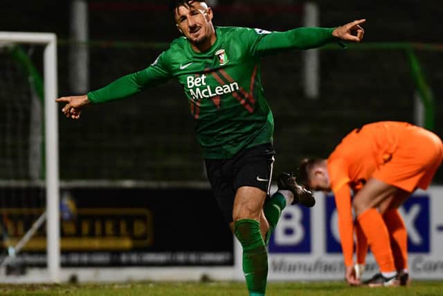 Danny Purkis' late finish secured success for Glentoran by a single goal over Ballymena United
