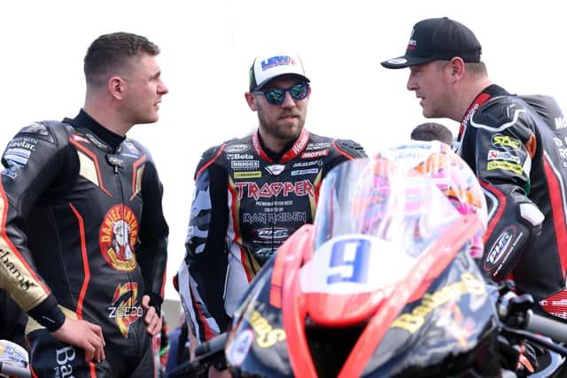 ​Peter Hickman (centre) with Craig Neve (left) and Brian McCormack on the grid yesterday at the North West 200. Picture: Stephen Davison/Pacemaker