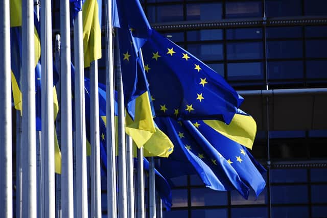 European Union's and Ukrainian flags fluttering outside the European Parliament in Strasbourg, eastern France