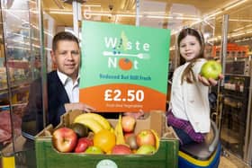 Lidl Northern Ireland has become the first supermarket retailer in the region to implement a rollout of a major new initiative aimed at reducing food waste and bringing shoppers even more savings at the tills. Lidl NI’s new Waste Not Fruit and Veg boxes will contain at least 5kg of mixed fruit and vegetables which are perfectly good to eat but have been separated from other products which have become slightly damaged and removed from multipacks. Pictured are Robert Ryan, chief operating officer, Lidl Ireland and Northern Ireland, and Lidl customer Sophie