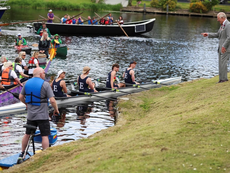 King Charles III gestures to people on boats, outside the Enniskillen Castle. Picture: Pool/Getty Images