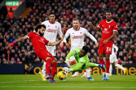 Manchester United goalkeeper Andre Onana saves a shot from Liverpool's Mohamed Salah at Anfield