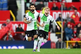 Scorer Mohamed Salah (left) with Harvey Elliott in Sunday's Premier League draw at Old Trafford. (Photo by Shaun Botterill/Getty Images)