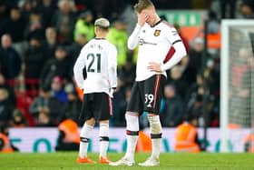 Manchester United's Scott McTominay (right) looks dejected after the final whistle in the Premier League match at Anfield