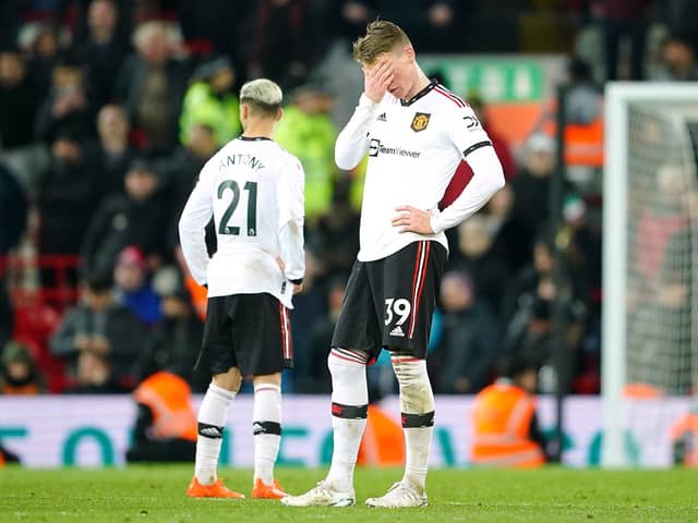 Manchester United's Scott McTominay (right) looks dejected after the final whistle in the Premier League match at Anfield