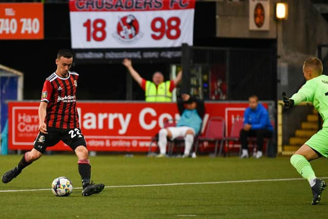 Paul Heatley slots home the game's decisive goal at Seaview in Crusaders' Europa Conference League victory over FC Haka. (Photo by Andrew McCarroll/Pacemaker Press)