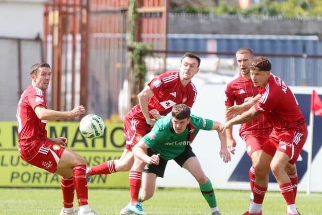 Glentoran’s Jordan Jenkins surrounded by, from left, Portadown players Gary Thompson, Lee Chapman, Lewis MacKinnon and Baris Altintop at Shamrock Park on Saturday. (Photo by JonathanPorter/INPHO/PressEye)