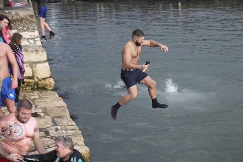 Leaping into 2023 at the annual New Year's Day swim in Carnlough, Co. Antrim. 
Pic Pacemaker