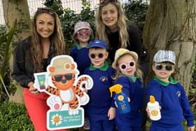 Pictured are children from Trinity Nursery School in Bangor with Miss Adair (left), and Cancer Fund for Children Schools and Youth Fundraiser, Rebecca Oates (right).