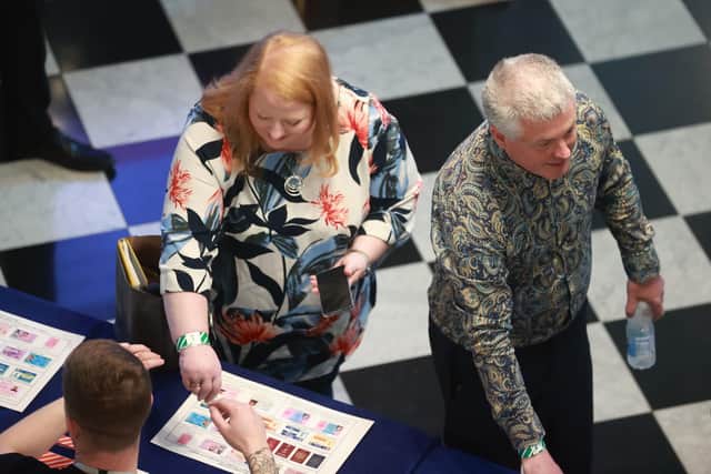 Alliance Party leader Naomi Long and her husband, Michael, who is standing as an Alliance candidate for Belfast City Council, arrive at Belfast City Hall as counting begins in the Northern Ireland council elections