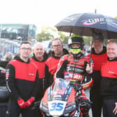 Dungannon teenager Jack Burrows on the Scars Racing Ducati with his dad John (second from right) and his team at Brands Hatch. (Photo credit: Scars Racing)