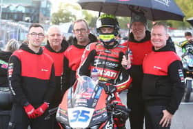 Dungannon teenager Jack Burrows on the Scars Racing Ducati with his dad John (second from right) and his team at Brands Hatch. (Photo credit: Scars Racing)