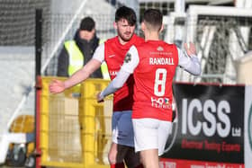 Lee Bonis celebrates with Mark Randall after netting Larne's second goal against Newington