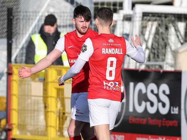 Lee Bonis celebrates with Mark Randall after netting Larne's second goal against Newington