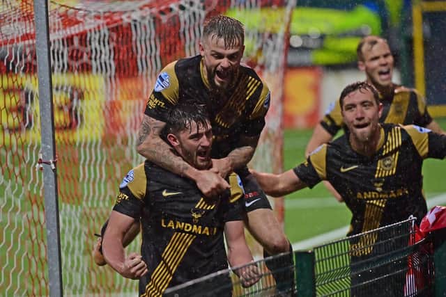 Lee Bonis and Larne team-mates celebrate his goal in victory over Cliftonville which put the Premiership league leaders one step closer to a landmark title win. Defeat for Linfield tonight in the 'Big Two' derby date with Glentoran would secure Larne a first top-flight league crown.