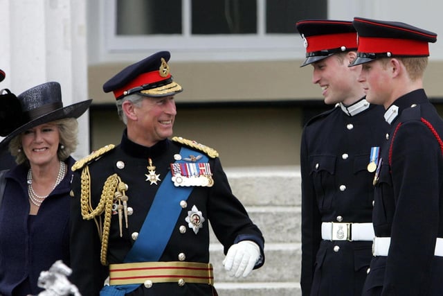 The Prince of Wales and the Duchess of Cornwall speak to Prince William and Prince Harry before leaving Sandhurst Royal Military Academy after The Sovereign's Parade that marked the completion of Prince Harry's Officer training. PRESS ASSOCIATION Photo Picture date: Wednesday April 12, 2006. The Prince was one of 220 cadets passing out and receiving their commissions into the British Army. See PA story ROYAL Harry. Photo credit should read: Tim Ockenden / PA.:PA:King Charles lll