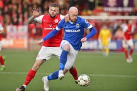 Larne’s Andrew Ryan and Linfield’s Chris Shields pictured in action during Friday night's game at Inver Park.
