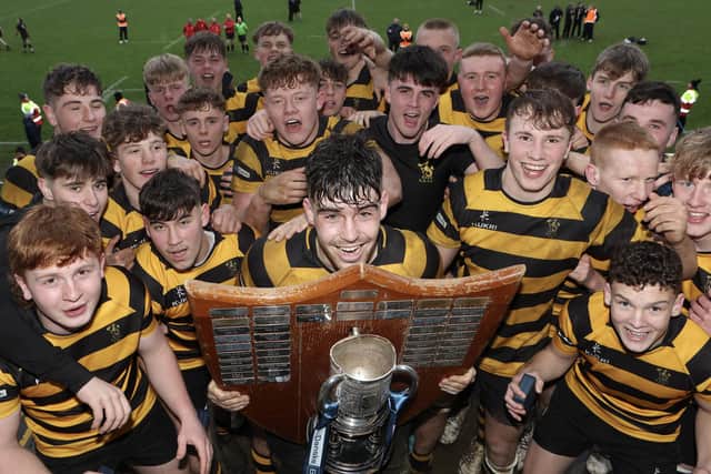 RBAI captain Jacob Boyd lifts the Danske Bank Schools' Cup after success over Campbell College