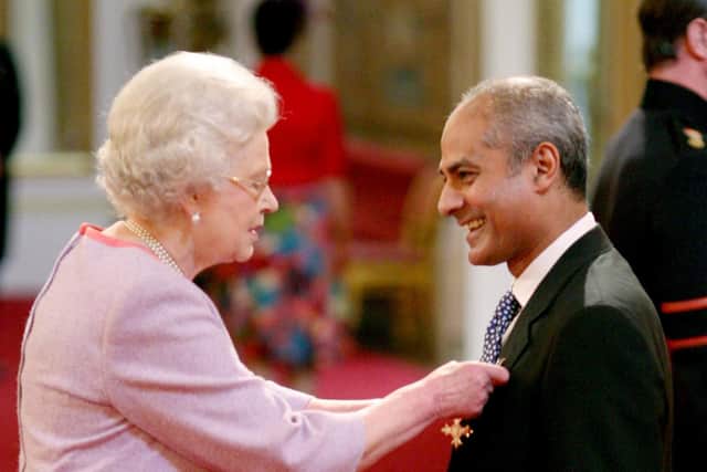 George Alagiah, journalist and television presenter is made an OBE by The Queen at Buckingham Palace