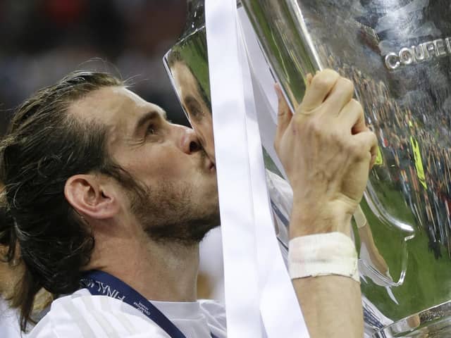 Real Madrid’s Gareth Bale kisses the trophy after the Champions League final against Atletico Madrid in 2016