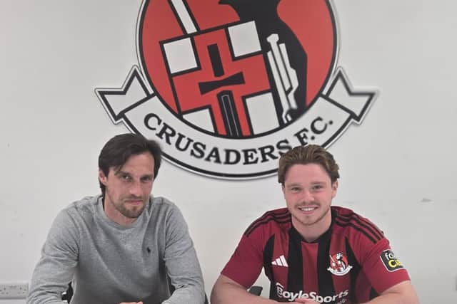 Crusaders chief Declan Caddell pictured with new signing Kieran McKechnie. (Picture: Crusaders FC)