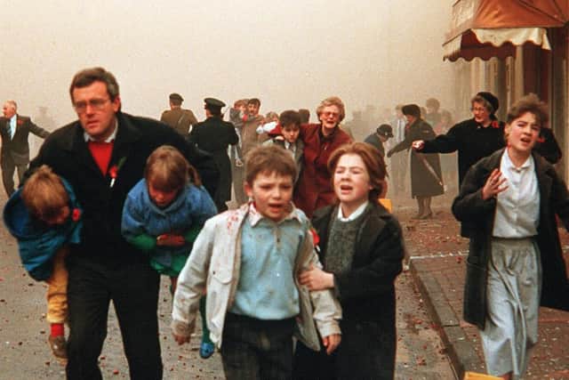 Distressed adults and children flee the scene of the 1987 Enniskillen Poppy Day bomb attack. The IRA blew up building at Remembrance Day service which killed 11 people who were standing in and around the area. 2022 marks the 35th Anniversary of the IRA bombing, one of the worst in the history of Northern Ireland's troubles. Photo: Pacemaker.,