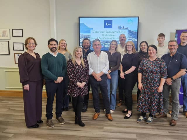 Jessica Hoyle, experience development manager at Tourism NI and Tina O'Dwyer, CEO of The Tourism Space, pictured with representatives of businesses involved in the latest cohort of the Sustainable Tourism Business Programme, which was launched at the Seamus Heaney HomePlace in Bellaghy this week