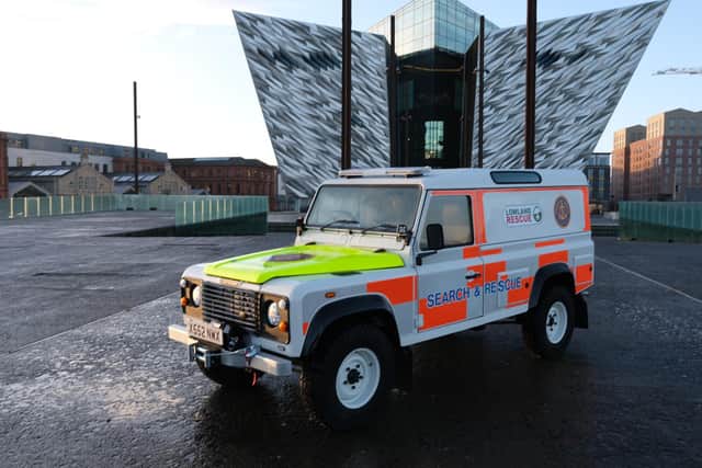 The finished Land Rover Defender during the reveal, in front of the Titanic Museum in Belfast. (National Geographic/Steve Bonser)