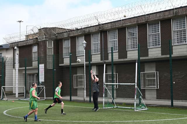 Prisoners play GAA at Maghaberry prison. Just one of the photographs on the theme of sport in prison making up part of the new exhibition in Belffast. Photo: Michael Cooper