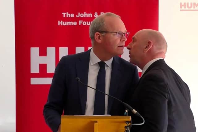 Screengrab taken from video issued by the Hume Foundation of Irish Foreign Affairs Minister, Simon Coveney, being ushered from the room due to a security alert whilst he was speaking at a peacebuilding event organised by the John and Pat Hume Foundation at The Houben Centre, Belfast