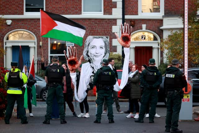 A protest outside Queen's University Belfast on November 14, 2024, during a visit from Hillary Clinton, Queen's University Belfast Chancellor, who was attending a Young Enterprise event at the University. Photo: Liam McBurney/PA