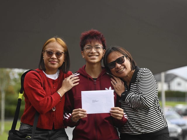 Ethan Rillon celebrates his GCSE results with his sister Angela Rillon (left) and his mother Jan Rillon at Hazelwood Intergrated College in Newtownabbey