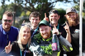 Donegal's Caomhan Canny celebrates his  Senior Manx Grand Prix victory with his team on the Isle of Man. (Photo by Stephen Davison/Pacemaker)