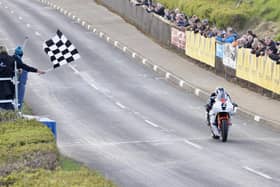 Michael Dunlop cross the line to win the Invitation Superbike race at the Cookstown 100 on the Hawk Racing Honda