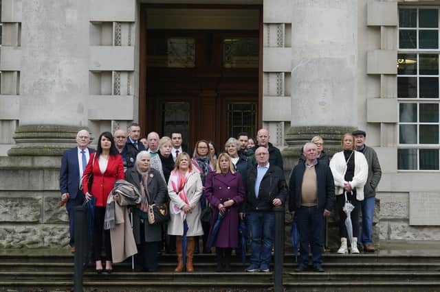 Grainne Teggart, Amnesty International UK's NI Deputy Director with victims families and supporters outside Belfast High Court. Brian Lawless/PA Wire