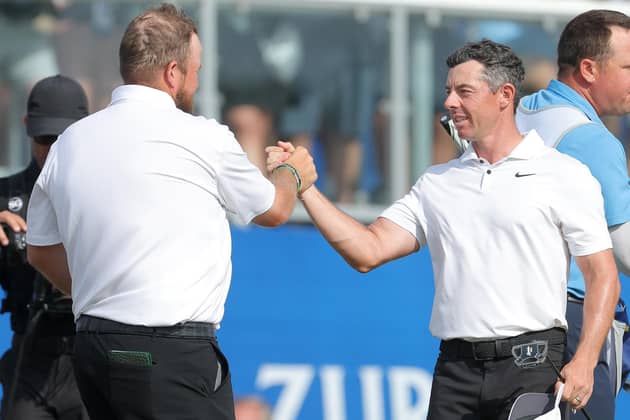 Northern Ireland's Rory McIlroy (right) celebrates with playing partner Shane Lowry after the pair's birdie finish on the 18th to force a playoff to settle the Zurich Classic of New Orleans at TPC Louisiana. (Photo by Jonathan Bachman/Getty Images)