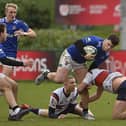 Lukas Kenny in possession earlier this year for Queen's. (Photo by Arthur Allison/Pacemaker Press)
